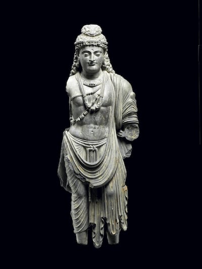 The 'Bodhisattva' sculpture from the Gandhara region, present-day Pakistan and Afghanistan (100 -300 CE). Louvre Abu Dhabi / Thierry Ollivier