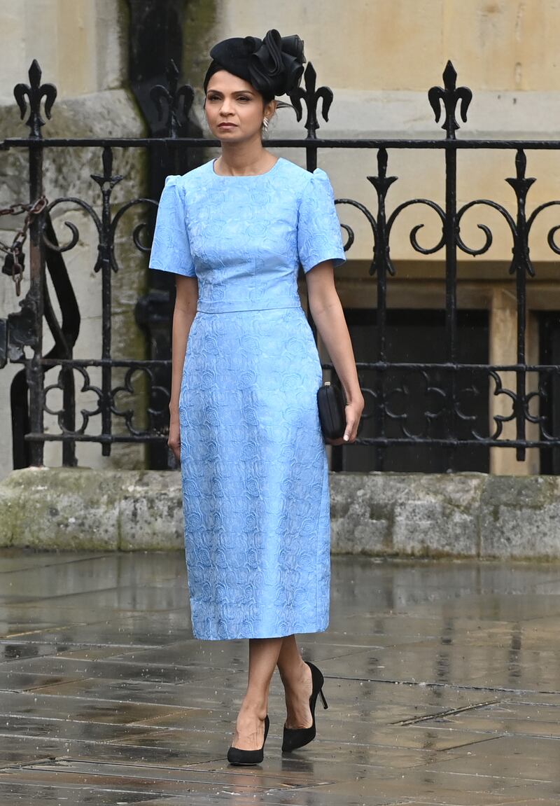 Sporting a botanical-printed, powder-blue satin dress for the coronation of King Charles III. Getty Images