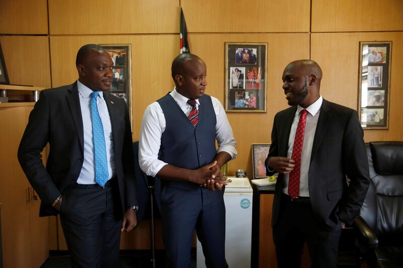 Nation media group manager for television Linus Kaikai, senior news reporter Ken Mijungu and news anchor Larry Madowo speak before an interview with Reuters at the Nation group media building in Nairobi, Kenya, February 1, 2018. REUTERS/Baz Ratner