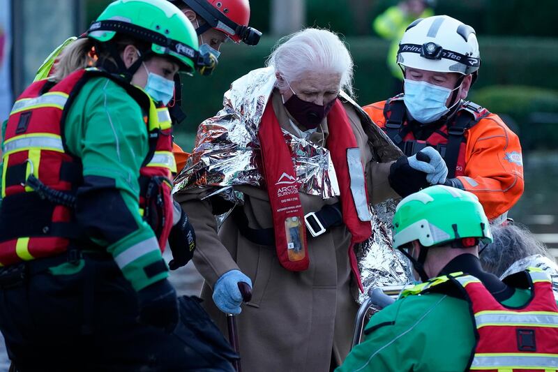One of the residents is checked on by emergency services personnel. Getty Images