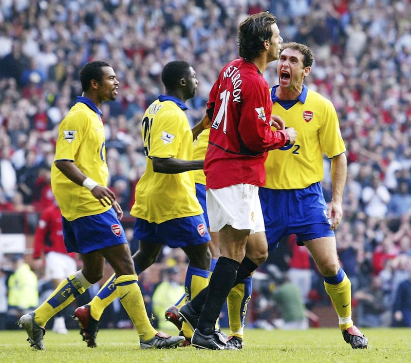MANCHESTER, ENGLAND - SEPTEMBER 21:  Martin Keown of Arsenal shows his feelings at Ruud Van Nistelrooy of Man Utd after Van Nistelrooy missed his penalty during the FA Barclaycard Premiership match between Manchester United and Arsenal at Old Trafford on September 21, 2003 in Manchester, England. (Photo by Shaun Botterill/Getty Images)