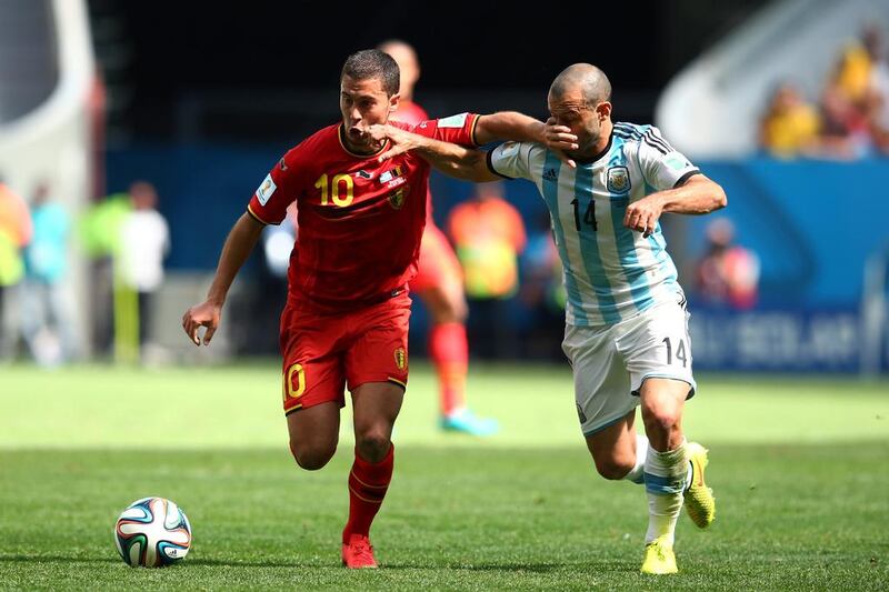 Eden Hazard of Belgium holds off the challenge of Javier Mascherano of Argentina during their match on Saturday at the 2014 World Cup in Brasilia, Brazil. Julian Finney / Getty Images