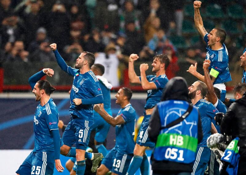 Juventus players join the fun after their late winner against Lokomotiv Moscow. EPA