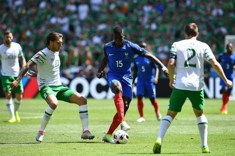 France midfielder Paul Pogba and Ireland midfielder Jeffrey Hendrick vie for the ball. Franck Fife / AFP
