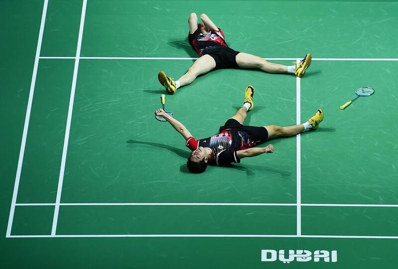 Lee Yong Dae and Yoo Yeon Seong of South Korea celebrate their victory over Chai Baio and Hong Wei of China in the men’s doubles final at the BWF Destination Dubai World Superseries badminton finals at Dubai. Christopher Lee / Getty Images