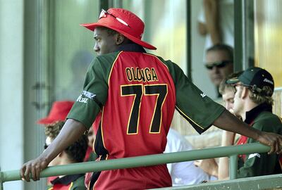 Zimbabwe bowler Henry Olonga wears a black armband in protest while in
the players' enclosure during Zimbabwe's first Cricket World Cup match
against Nambia at the Harare Sports Club February 10, 2003. Olonga and
team mate Andy Flower, in a joint statement released just before
Zimbabwe's Group A game, said they would wear black armbands during the
event in an unprecedented attack on the running of the strife-torn
country. REUTERS/Howard Burditt

HB/CRB - RP3DRIMSAWAA