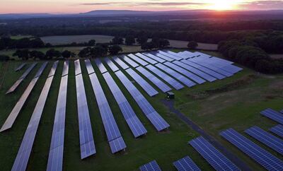 Rows of solar panels in a field near Five Oaks, West Sussex. PA