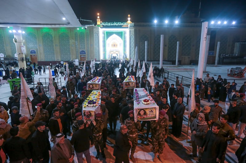Iraqis attend the funeral of the Kataib Hezbollah members in Najaf, Iraq, on November 22, after US air strikes.  AP