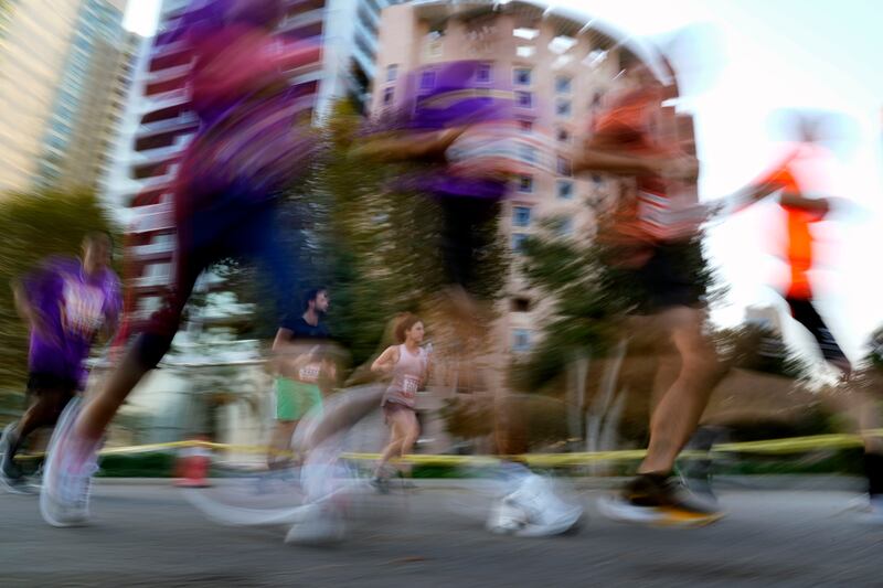 A picture of runners using a slow shutter speed to show motion. AP
