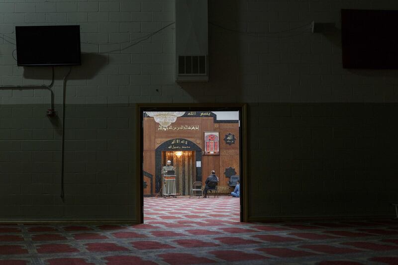 Imam Magdy Badr leads prayers over a live broadcast on a laptop in a nearly empty room at Masjid Al Salaam mosque on the first full day of Ramadan on April 24, 2020 in Dearborn, Michigan. Getty
