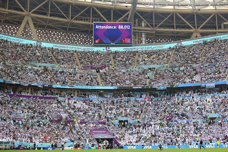 Crowd attendance is shown on a giant screen at the Lusail Stadium. Getty