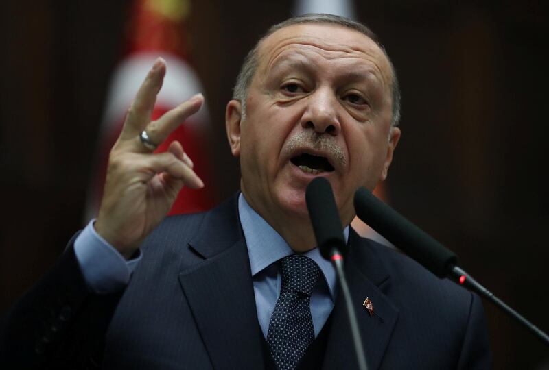 Turkish President Tayyip Erdogan addresses members of parliament from his ruling AK Party (AKP) during a meeting at the Turkish parliament in Ankara, Turkey, January 8, 2019. REUTERS/Umit Bektas