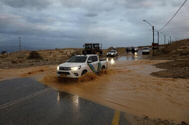 A security vehicle drives through flood water following heavy rainfall in the Jerusalem area on Thursday. AFP