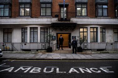 Police and a doorman stand outside the entrance to the King Edward VII hospital where Prince Philip, the Duke of Edinburgh, is currently receiving treatment in hospital as a "precautionary measure", Buckingham Palace has said. (Photo by Chris J Ratcliffe/Getty Images)