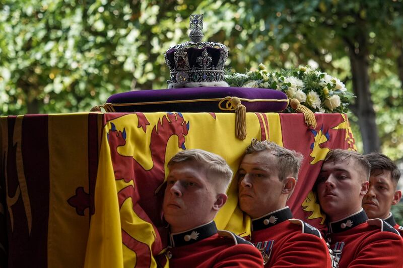 Pall bearers carry the coffin of Queen Elizabeth II during Wednesday's procession from Buckingham Palace to Westminster Hall in London. AP