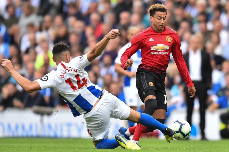 Manchester United's Jesse Lingard, right, takes on Brighton's Leon Balogun. AFP
