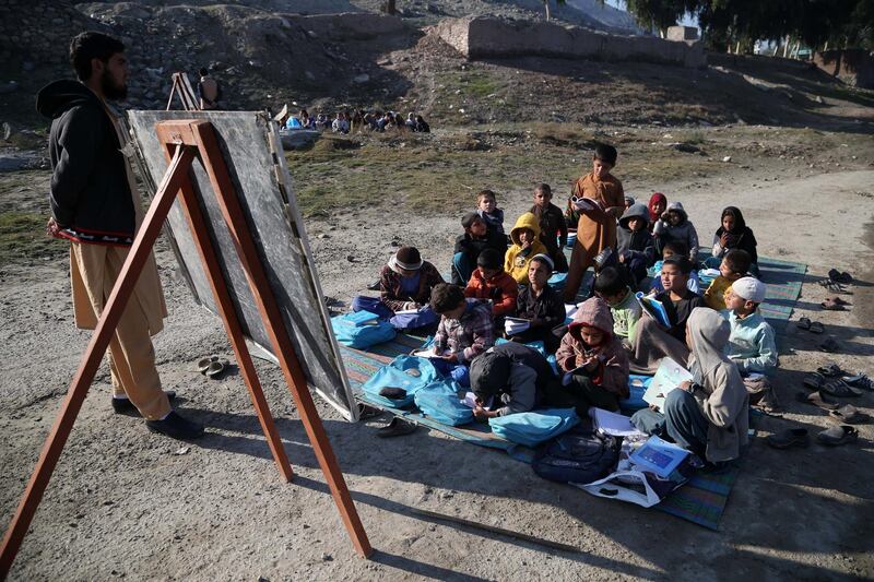 Afghan children take a class in open due to lack of school and facilities in Laghman.  EPA