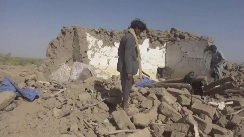 People rummage through rubble after an air strike in Yemen's Jawf province Yemen in this still image taken from a video. Houthi Media Centre via Reuters