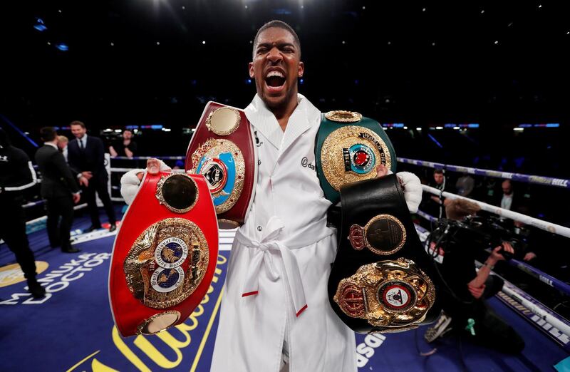 Boxing - Anthony Joshua vs Joseph Parker - World Heavyweight Title Unification Fight - Principality Stadium, Cardiff, Britain - March 31, 2018   Anthony Joshua celebrates with the belts after winning the fight    Action Images via Reuters/Andrew Couldridge     TPX IMAGES OF THE DAY