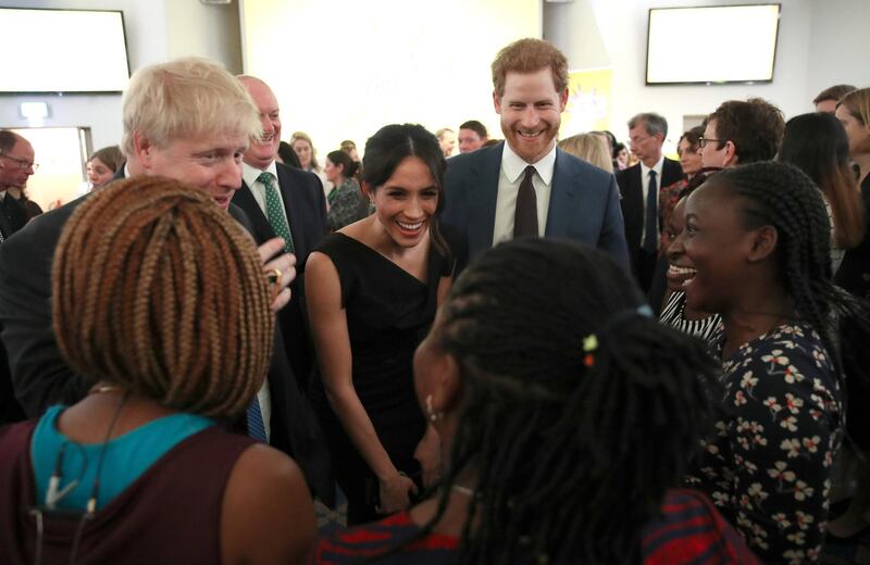 Foreign Secretary Boris Johnson, Meghan Markle and Prince Harry speak with guests as they attend the Women's Empowerment reception hosted by the Foreign Secretary during the Commonwealth Heads of Government Meeting at the Royal Aeronautical Society on April 19, 2018 in London, England.  Chris Jackson/Pool via Reuters