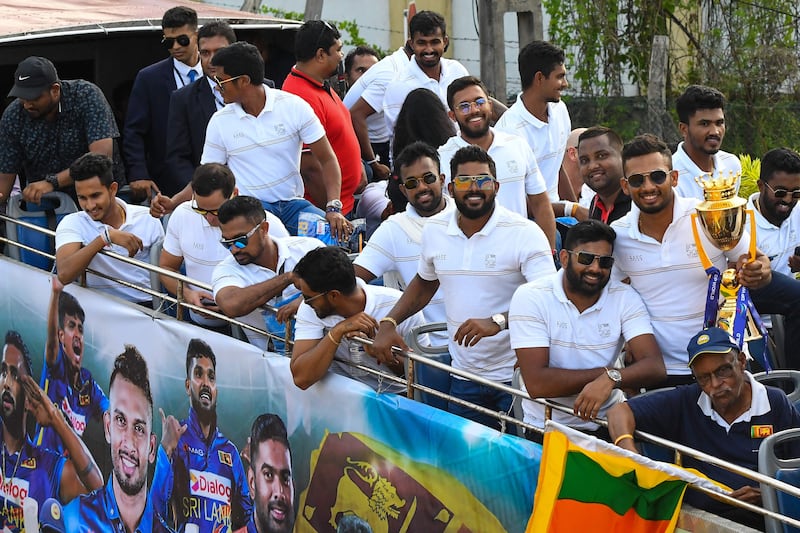 Sri Lankan players during an open-top bus parade in Colombo. AFP