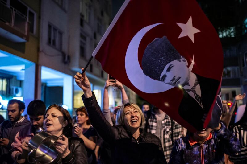 Supporters of Istanbul Mayor Ekrem Imamoglu shout anti-government slogans as they take part in a protest against the re-run of Istanbul mayoral election in Istanbul.  AFP