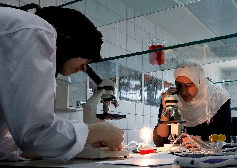 Dubai, 28th November 2010.  The Lead Inspector from Dubai School Inspection Bureau was at hand to observe the ongoing Advanced Placement Biology laboratory exercises of the grade 12 students, held at the Al Mizhar American Academy for Girls.  (Jeffrey E Biteng / The National)