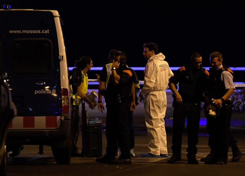 Policemen check the area after police killed five attackers in Cambrils near Tarragona on August 18, 2017.
Drivers have ploughed into pedestrians in two quick-succession, separate attacks in Barcelona and another popular Spanish seaside city, leaving 13 people dead and injuring more than 100 others. The incident in Cambrils injured six civilians -- one of them critical -- and a police officer, authorities said.  / AFP PHOTO / LLUIS GENE