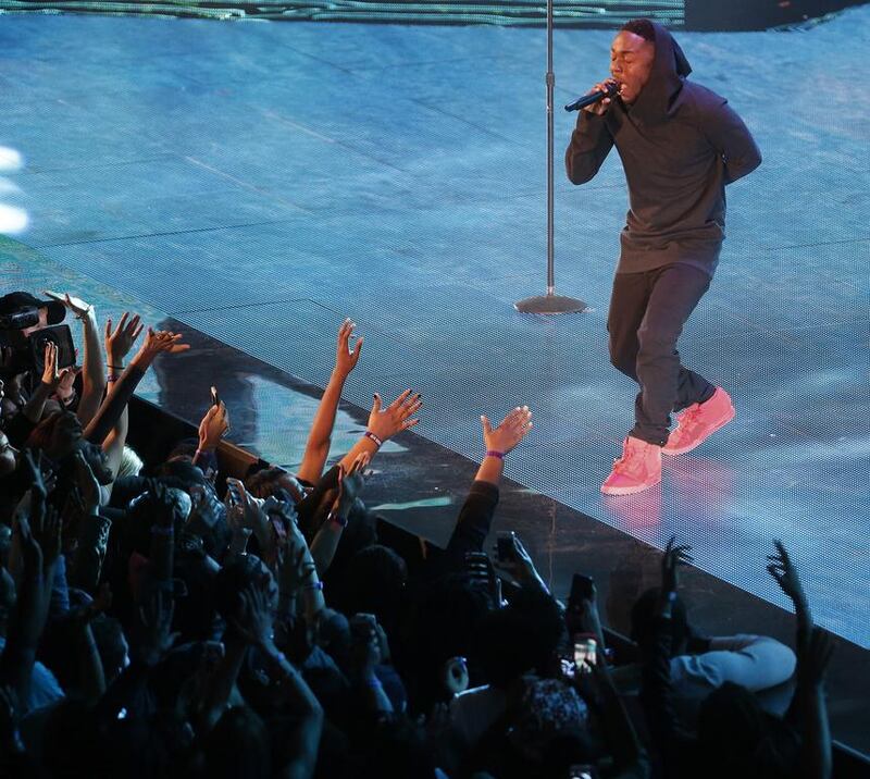 Singer Kendrick Lamar sings at a break during the skills competition at the NBA All Star basketball game. Bill Haber / AP photo