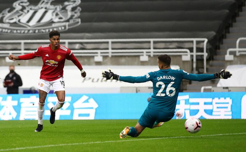 Manchester United's Marcus Rashford scores the fourth. AP