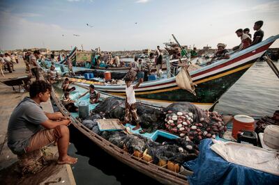 FILE - In this Sept. 29, 2018 file photo, fishermen rest on their boats before fishing at the main fishing port, in Hodeida, Yemen. Officials in Yemen said a cease-fire took effect at midnight Monday, Dec. 18, 2018, in the Red Sea port of Hodeida after intense fighting between government-allied forces and Shiite rebels erupted shortly before the U.N.-brokered truce. Yemen's civil war, in which a Saudi-led coalition is fighting on the governmentâ€™s side against the rebels, has pushed much of the country to the brink of famine. (AP Photo/Hani Mohammed, File)