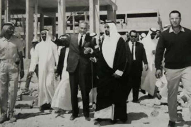 Sheikh Zayed and Abdel Rahman Makhlouf visit the construction site of the original central souq.