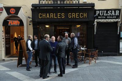 VALLETTA, MALTA - MARCH 30:  Local men stand outside a pub on March 30, 2017 in Valletta, Malta. Valletta, a fortfied town that dates back to the 16th century, is the capital of Malta and a UNESCO World Heritage Site. In the last 2,000 years Malta has been under Roman, Muslim, Norman, Knights of Malta, French and British rule before it became independent in 1964. Today Malta remains a crossroads of cultures and is a popular tourist destination. (Photo by Sean Gallup/Getty Images)