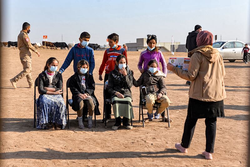 A workshop by Global Clearance Solutions to teach children from Hasan Jalad how to identify and report suspected landmines or unexploded ordnance near their village in northern Iraq. AFP