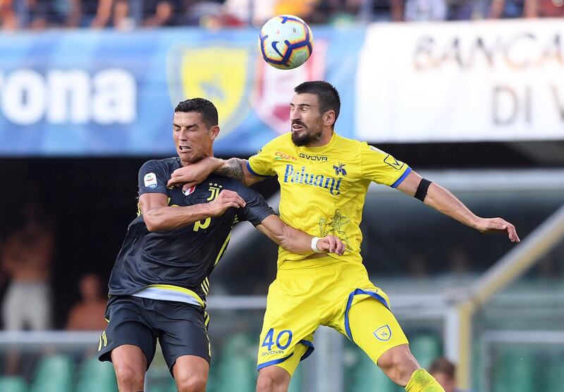 Cristiano Ronaldo in action with Chievo's Nenad Tomovic. Reuters