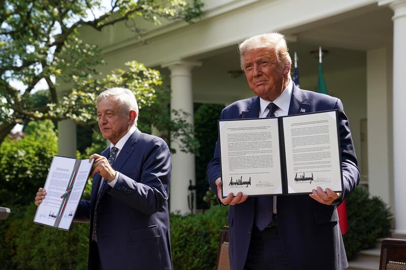 US President Donald Trump holds a joint declaration he signed with Mexico's President Andres Manuel Lopez Obrador in the Rose Garden at the White House in Washington, US. Reuters
