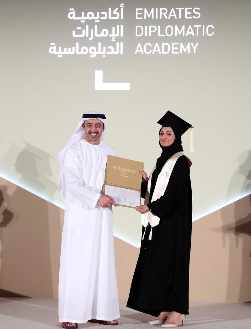 Sheikh Abdullah bin Zayed, Minister of Foreign Affairs and International Cooperation and chairman of the Board of Trustees of the Emirates Diplomatic Academy, awards one of 34 students their post-graduate diploma. Wam