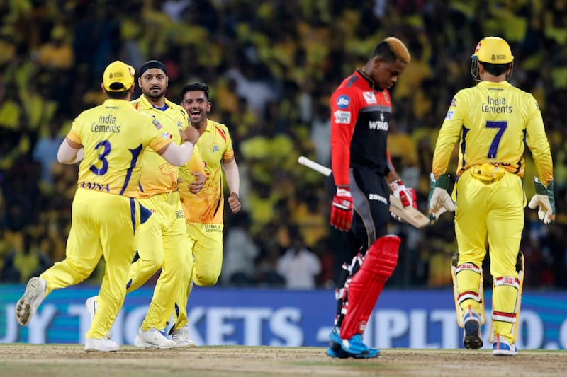 Chennai Super Kings players celebrate the dismissal of Royal Challengers Bangalore's Shimron Hetmyer, second right, during the VIVO IPL T20 cricket match between Chennai Super Kings and Royal Challengers Bangalore in Chennai, India. AP Photo