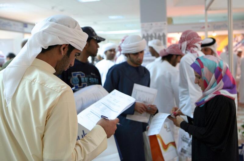 Emirati students looking for jobs at a career fair.  Paulo Vecina / The National 