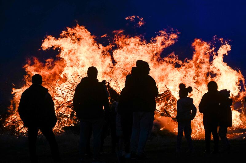 Revellers watch a bonfire burn as Bulgarians celebrate Mesni Zagovezni, an Orthodox Christian holiday, in Lozen, 15km south-west of the capital Sofia. AFP