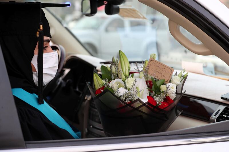 Ajman, United Arab Emirates - Reporter: Anam Rizvi. News. Afra Mohammed waits in her car before her drive through graduation from Ajman University because of Covid-19. Wednesday, February 10th, 2021. Ajman. Chris Whiteoak / The National