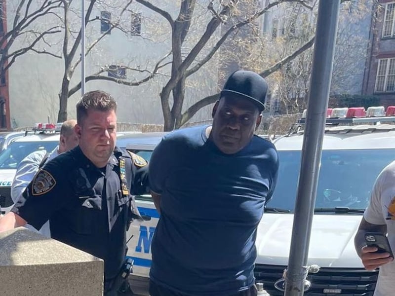 New York City police officers take Brooklyn subway shooting suspect James Frank into custody. Photo: NYPD