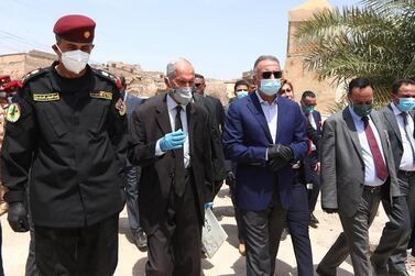 Iraqi Prime Minister Mustafa Al Kadhimi (3-L) arriving in the northern city of Mosul, for a visit on the occasion of the 5th anniversary of the capture of the city by ISIS. AFP