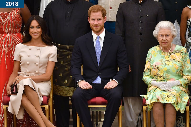 2018: Meghan Markle, Prince Harry, and the queen at the Queen's Young Leaders Awards Ceremony at Buckingham Palace.