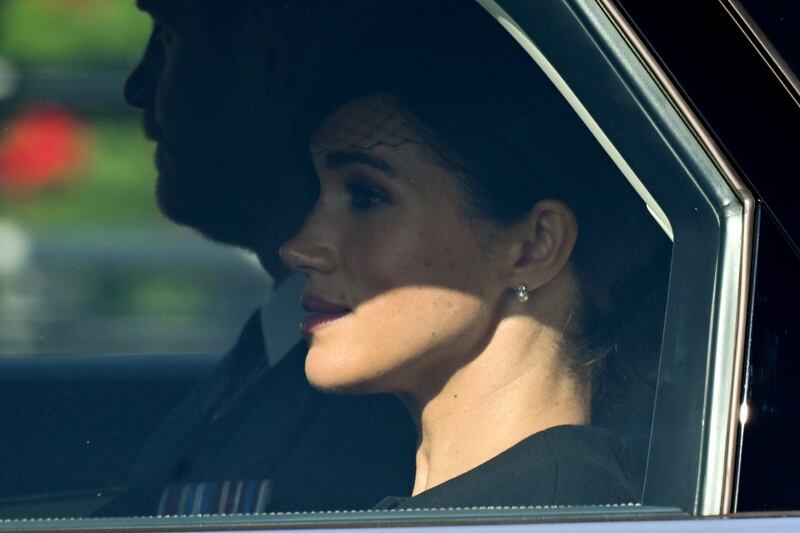 Meghan, Duchess of Sussex, and Prince Harry depart after the procession. Getty Images