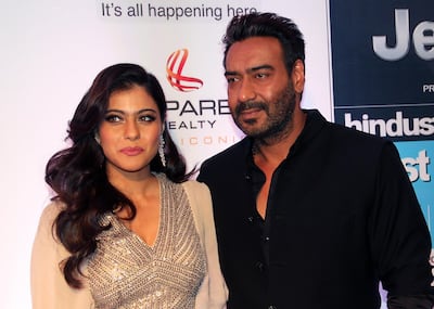 Indian Bollywood actress Kajol Devgn (L) and actor Ajay Devgn pose as they attend the "HT Most Stylish" awards ceremony in Mumbai late March 24, 2017. (Photo by STR / AFP)