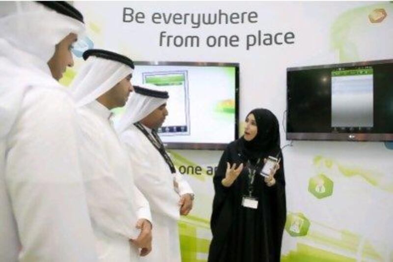 Maha Muraish, the director of online channels and portals at Etisalat, explains the ePlus app at Gitex. Antonie Robertson/The National