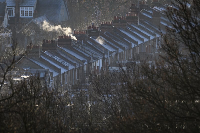 Steam rises from the central heating vents of houses in London. The UK government is under pressure to help British households facing steep hikes in gas prices. Getty Images