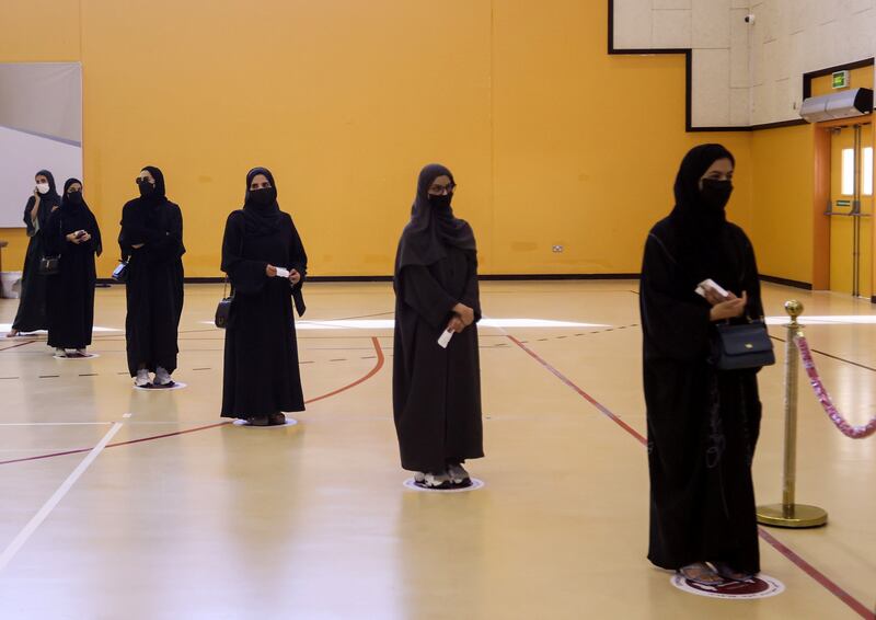 Voters line up at a polling station in Qatar's first legislative elections for two-thirds of the advisory Shura Council. Reuters