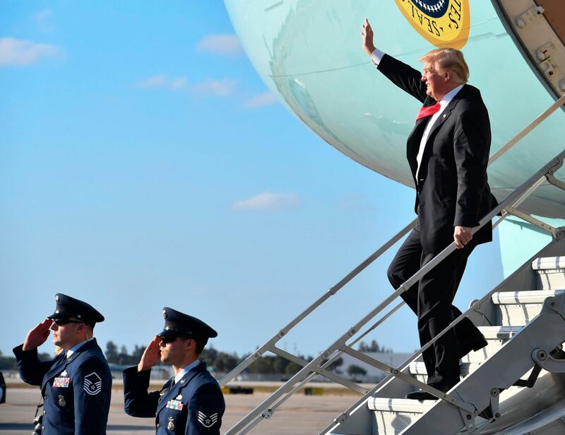 US president Donald Trump waves from Air Force One upon arrival in West Palm Beach, Florida. Nicholas Kamm / AFP Photo